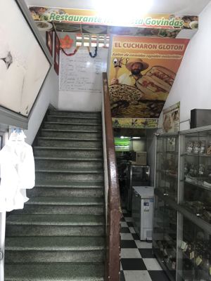 Enter and go upstairs for the restaurant  at Govinda's in Barranquilla