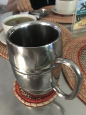 Juice with menu of the day was in a funky mug at Govinda's in Barranquilla