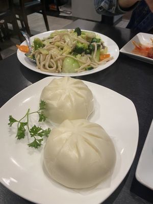 Steamed buns & very garlic fried noodle in background- obsessed   at Veggie Garden in Mountain View
