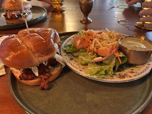 Brisket sandwich with side salad and Caesar dressing   at Marian Cocktails and Kitchen in Raleigh