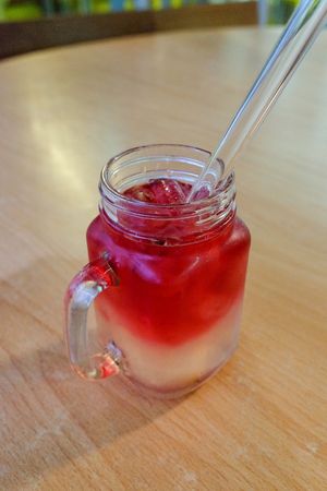 Rose lemon drink with glass straw
 at Loving Hut in Central Singapore