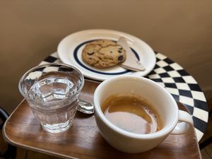 Double espresso and chocolad chip cookie  at Revista Coffee and Magazines in Groningen