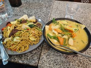 Hokkien noodles with vegan beef on the left and tofu laksa on the right. at Peace Harmony in Sydney