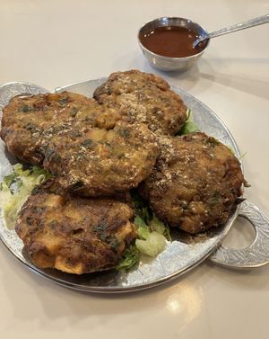 Mixed Pakora Appetizer (mixed vegetables fried in chickpea batter). Subbed the non-vegan mint dipping sauce for one that is vegan. at Saffron Indian Grill & Bar in Eagan
