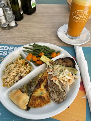 Vegan selection served with freshly made juice  at Capre e Cavoli in Brescia