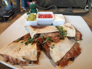 Quesadilla with rich 'meaty' fillings, melted "cheese" and even 'sour creme'; all completely animal free and all completely delicious.  at Plant in Cape Town