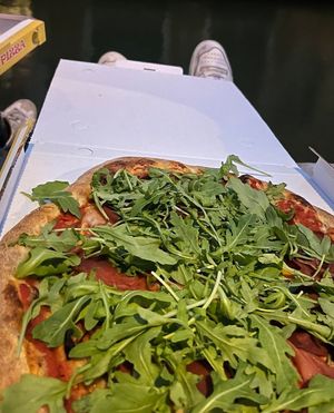 It is take away - but nice spots are easy to find at Pizzeria L'Angelo in Venice