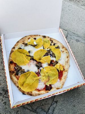 Vegan pizza “sirio” with soy ham (the yellow things), vegan cheese, mushrooms, and purple onion at Pizzeria L'Angelo in Venice