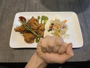 Sabzi Ke Pakode (vegetables fried in chickpea flour) and FIST (of Destiny) with a tiny salad and 3 different kinds of sauces.  at Indian Village in Gothenburg
