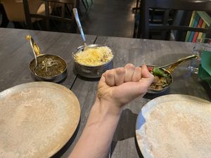 From left to right: Tofu Palak, rice (duh), the obligatory Fist of Destiny, and Baingan Mirch Ka Salan (eggplant stuff). Yum!  at Indian Village in Gothenburg
