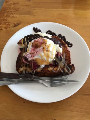 French toast with sliced banana, berries and coconut cream at Eat.Co Brunchrie in Koh Phangan