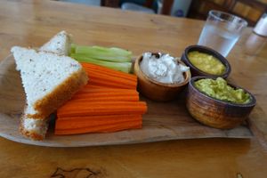 Guac, hummus and cheese dips with bread, cucumbersticks and carrotsticks. at Eat.Co Brunchrie in Koh Phangan