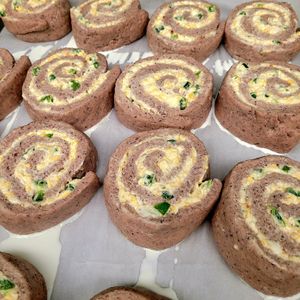 Blue corn , juniper ash jalapeno popper rolls. 
Diné blue corn, roasted and stone ground, wild harvested juniper ash,  jalapenos , v. Cream cheese , smoked bacn bits, crunchy amranth topping  at Ch'il Indigenous Foods - Pre-order in Wheat Ridge