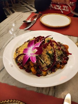 Samosa Chaat without yogurt was good we liked the crunchy noodles on top and edible flower at Red Chilli  in Jackson Heights