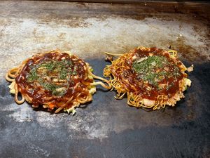 Standard vegan okonomiyaki with udon noodles (left), Vegan Special (right)  at Okonomiyaki FUJI in Takehara