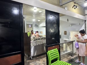From sidewalk/ outdoor seating area  at Pupusería La Ceiba in Santa Ana