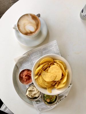Almond Milk Cappuccino & Vegan Nachos (not really “nachos,” more like chips with dips including cashew cheese)  at Alma Cafe in Tel Aviv