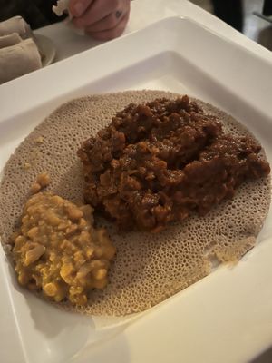 Red le tiles with split peas on the side   at DAS Ethiopian in Washington