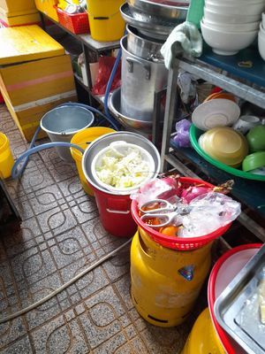 Kitchen is outside on the pavement at Hủ tíu Chay in Ho Chi Minh City