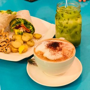 Matcha latte ice, cappuccino and wrap at Well Dressed Salad Bar and Cafe in Central Singapore