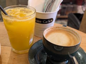 Fresh orange juice and oat flat white at B'elicious in Farnham