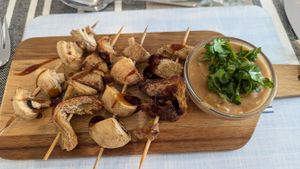Vegan chicken and mushroom skewers with satay sauce (starter) at All Good Things Vegan in Paignton