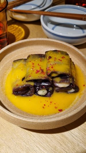 Eggplant "Cheeze" Rolls: I hesitated at first because I’m usually not a fan of orange in savory dishes, but I’m so glad I gave it a try! The flavors worked beautifully 🤤 at chaochao. vegan food and natural wine bar in Beijing
