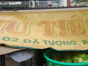 Old faded sign outside at Hu Tiệu Chay in Ho Chi Minh City
