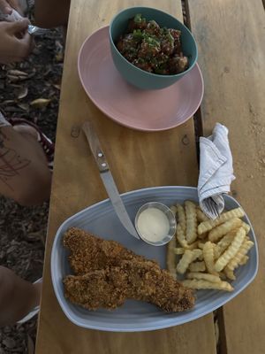 Orange chicken with noodles & schnitzel with fries  at Amet - Cocina basada en plantas in Guadalajara