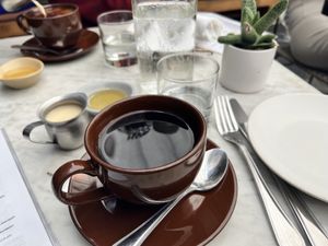 No lattes.  But good coffee, with oat or almond milk, and a variety of sweetener choices (including agave).   at Gracias Madre - WeHo in West Hollywood