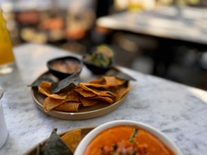 Starter, the Queso is warm with incredible flavors, and no Mexican meat is complete without Chips and Salsa  at Gracias Madre - WeHo in West Hollywood