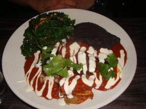 ENCHILADAS CON MOLE
Spicy mole enchiladas topped with mushrooms and cashew cheese, served with sautéed greens and beans at Gracias Madre - WeHo in West Hollywood