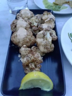 COLIFLOR FRITO - flash-fried cauliflower, cashew nacho cheese, lemon at Gracias Madre - WeHo in West Hollywood