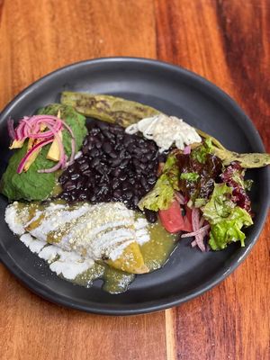 Traditional "Chan" Breakfast, served with Eggs, salad, beans, Nopales and hand made Antojitos de masa. Optional Vegan sour cream. at Pook in Playa Del Carmen