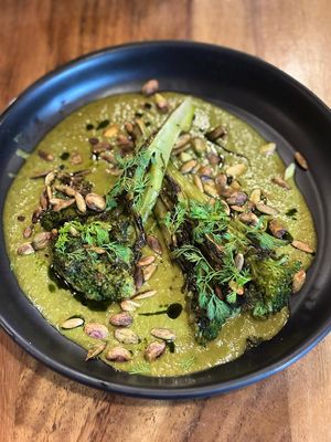 Grilled Brocoli served on top of Gremolata made out of Yucatecan Lime and pepita. at Pook in Playa Del Carmen