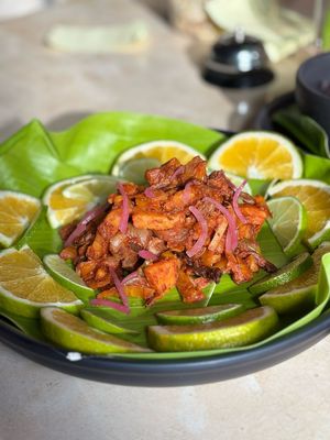 Mushroom Barbacoa, Cooked inside plantain leaf, served with sour orange, guacamole, beans, tortillas and salsas. at Pook in Playa Del Carmen
