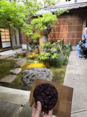 Enjoying the cookie in the Japanese garden beside the cafe behind perfume shop  at LE LABO KYOTO 京町家 in Kyoto