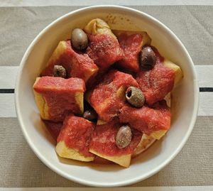 Chickpea tofu, tomato passata & olives at Mamma Michela  in Desenzano Del Garda