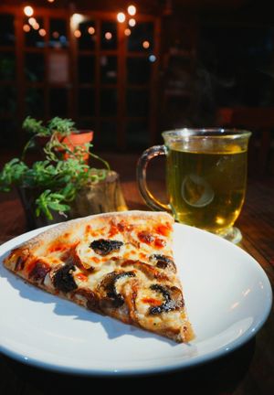 A sílice of pizza with a delicious te a perfect way to relax in the afternoon.  at Tierra Verde in Veracruz