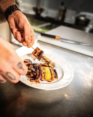 Eggplant skewers, glazed with balsamic vinegar and soy at Bluesquare in Milan
