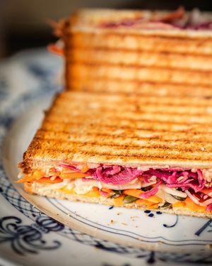 Bluesquare Toast, with kale, cabbage, mustard, veg cheddar, and crunchy pumpkin seeds at Bluesquare in Milan