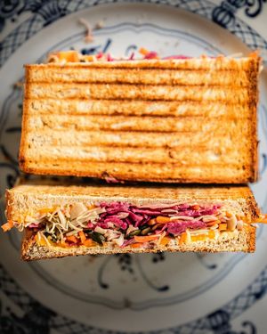 Bluesquare Toast, with kale, cabbage, mustard, veg cheddar, and crunchy pumpkin seeds at Bluesquare in Milan