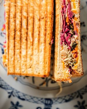 Bluesquare Toast, with kale, cabbage, mustard, veg cheddar, and crunchy pumpkin seeds at Bluesquare in Milan