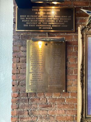 Plaque noting that this one was the location of the famous Improv club at Don Giovanni - Time Square in New York City