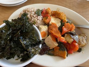 PET curry with tofu and kale chip sides  at Red Curry Vegan Kitchen in Flagstaff
