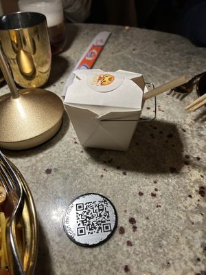 Cocktail in a take out box  at Laut in New York City