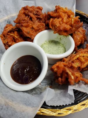 Pakora with tamarind sauce. The other one may have had dairy, we didn't eat it. at Momo Heaven in Carlisle