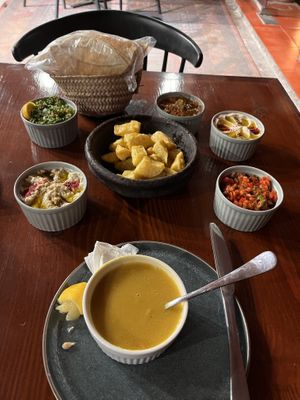 Potatoes & combination of side saladss  at Osturi - اسطوري in Al Ula