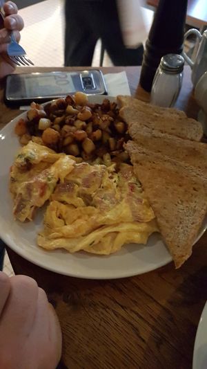 Scrambled eggs with vegan bacon potatoes and toast at Mamalicious in Hamburg