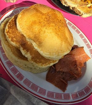 Pancakes stack with maple syrup and veg bacon at Mamalicious in Hamburg